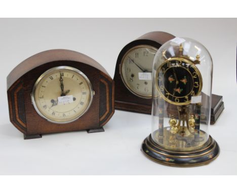 An Anniversary clock, black dial decorated with flowers, Arabic numerals; together with a 1930s Enfield, oak cased mantle clo