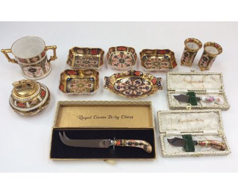 Royal Crown Derby: a pair of small 1128 pattern footed toothpick holders, a loving cup, a lighter, five pin trays and three c