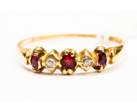 A ruby and diamond gold ring, set with three rubies and two diamonds late Victorian, size S, total gross weight approx 2gms