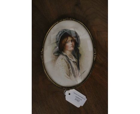Ethel M. Walker (British, 20th Century), portrait of a pretty young lady, half length wearing a bonnet, signed l.r., watercol