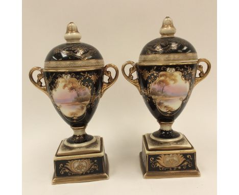 A pair of 1920s Noritake twin handled covered vases on plinths (2) 