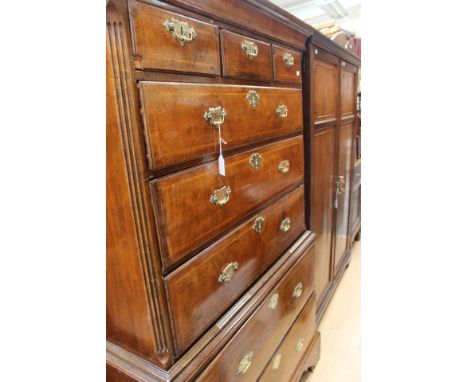 A George I walnut veneered chest on chest, the upper section with three drawers to top over three long graduated drawers, the