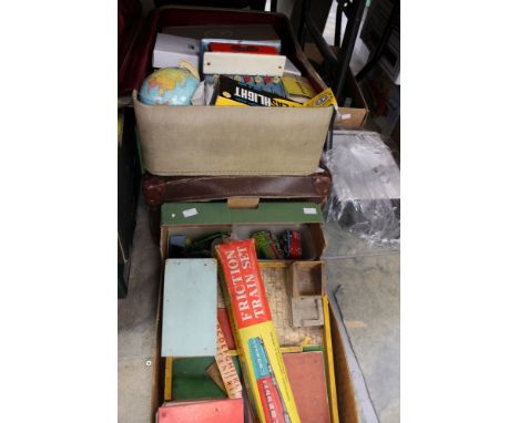 Two cases of toys and games as well as tinplate items including a motorcyclist, and others, together with a box of farm anima