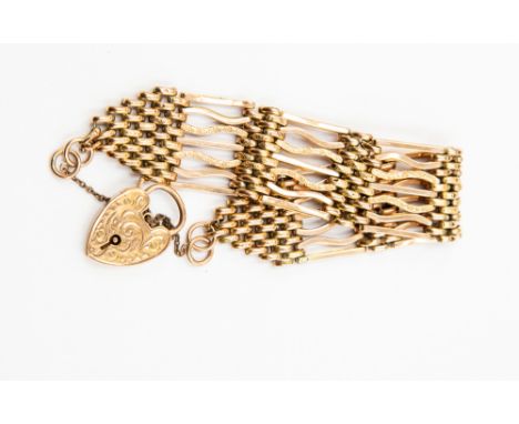 A 9ct gold gate-link bracelet, width approx 22mm, padlock clasp, weight approx 23gms