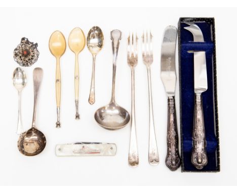 A boxed silver handled cheese knife; together with a silver handled knife, two silver forks, a ladle, a shaker spoon, two tea