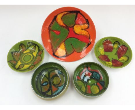A Poole Pottery plate, abstract design, together with four similar dishes (5)  