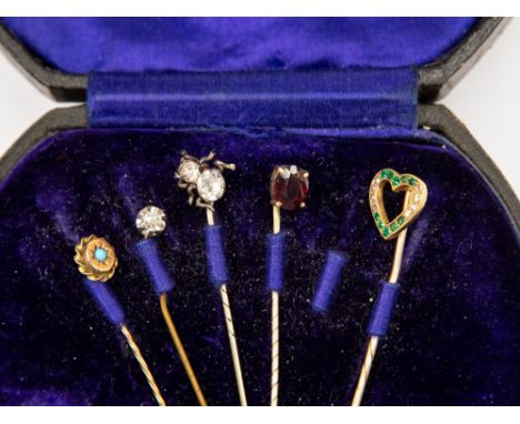 Five assorted stick pins to include a gold diamond and emerald set heart, a Victorian turquoise set 9ct gold, etc 