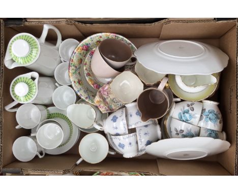 A collection of china tea and coffee service; together with a dessert service, cream and sugar server and Poole pottery (one 