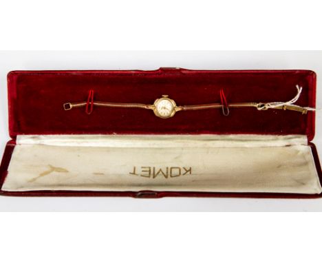 A 9ct gold ladies Tissot watch, round dial with a flat snake link bracelet, total gross weight approx 16gms boxed