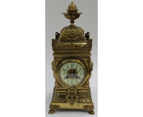 A French 19th Century 1860/1880 brass mantle clock, with enamel dial Arabic numerals