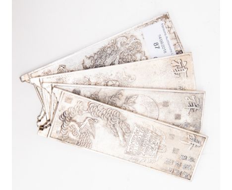 A Chinese silver set of four panels with carved symbols, animals marked