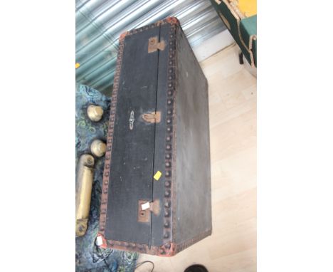 An early 20th Century leather travelling trunk, together with a circular topped coffee table, raised on cabriole legs (2)