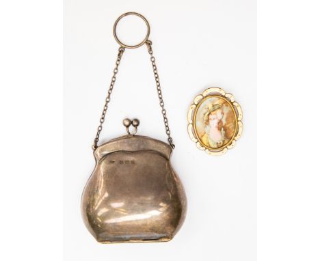 A silver evening purse, silk lined, Birmingham 1916, weighing approx 2.08 ozt, with a ceramic brooch, stenciled picture of la