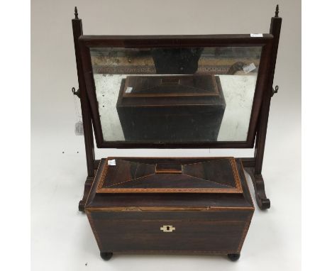 Georgian inlaid mahogany tea caddy and a mahogany toilet mirror