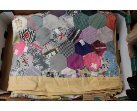 A patchwork quilt in various colourways and printed vintage fabrics, double bed size, edged in mustard cotton, late 1920s/193