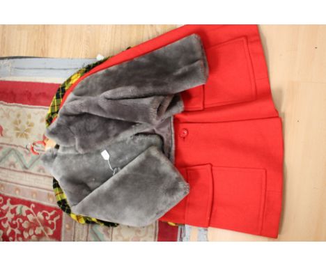 An early 1960s short grey faux fur jacket with two pearlised buttons, three quarter length sleeves, a red wool cape with larg