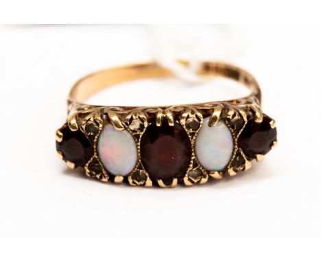 An opal and garnet five stone 9ct gold ring, comprising three garnets with two opals set in between, scroll mount, size R1/2,