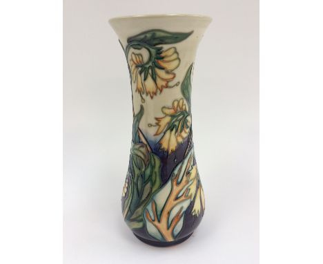 A Moorcroft vase signed by Phillip Gibson, boxed, set yellow flowers on cream and purple ground, first quality  