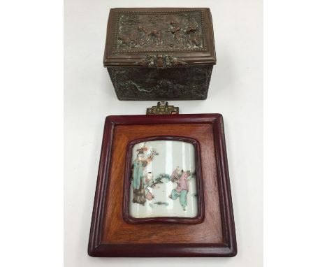 Silver plated box (loss of plate) figures in relief, together with a framed, ceramic oriental piece (2) 