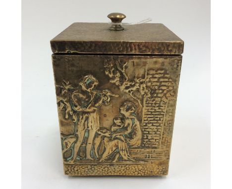 A brass tea caddy