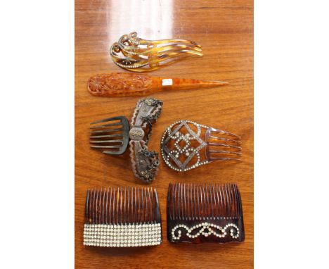 A collection of vintage combs to include: a paste wide banded square type comb, a diamante paste comb with a high head piece,