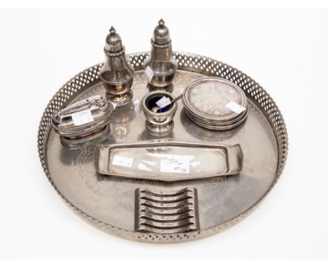 A collection of silver plate including a tray, cruet set, coasters with stand and a lighter 