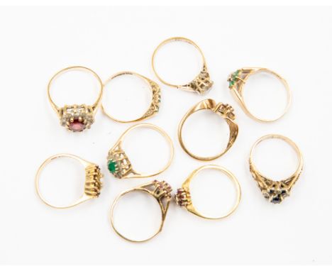 A collection of 9ct gold cluster rings, some set with ruby, garnet sapphire and emerald, with a total combined gross weight a