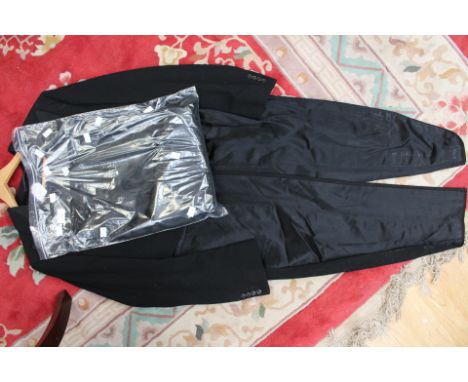 A black 1930s tail coat cut away waist (strictly for dancing) together with an original shirt bag with evening scarf with bla