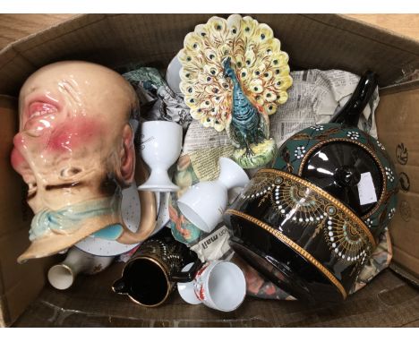 19th Century egg cups, a Sarrequenines character jug, a 19th century peacock spill vase, impressed 681712 to base, Jackfield 