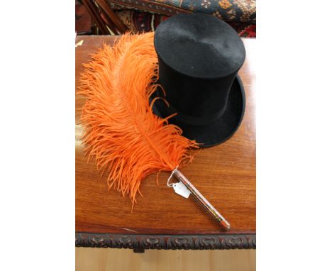 A silk top hat (Best London) 1930s; together with a large Ostrich feather fan in a burnt orange colour on an iridescent stick