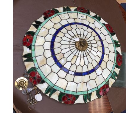 A large stained glass ceiling pendant light shade 