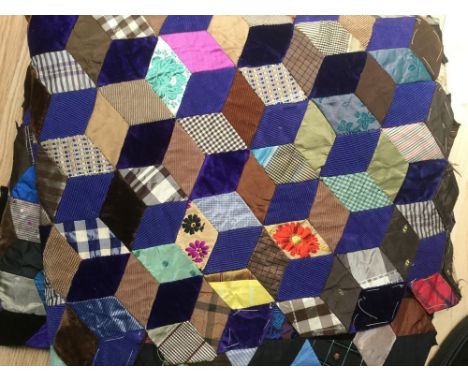 An Edwardian patchwork item intended for a tablecloth made of original Victorian/Edwardian remnants and old ties in taffeta/v