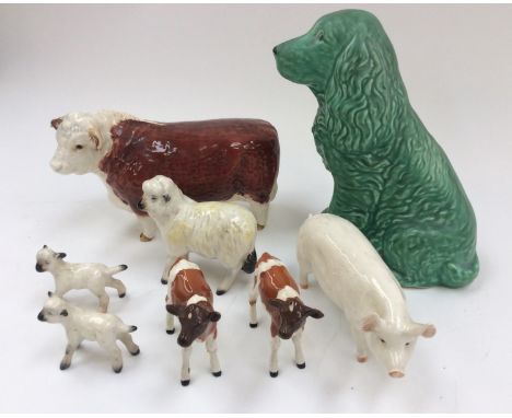 A collection of Beswick farm animals, comprising calves, bull, lambs, pig, sheep and a Sylvac green dog 