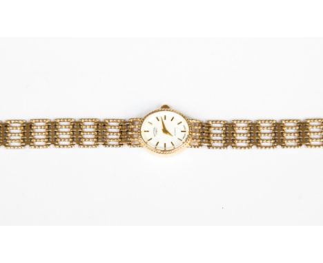 A 9ct gold ladies Rotary wristwatch, oval dial, approx size 15mm x 17mm,  with a fancy link chain, approx length 18cm, total 