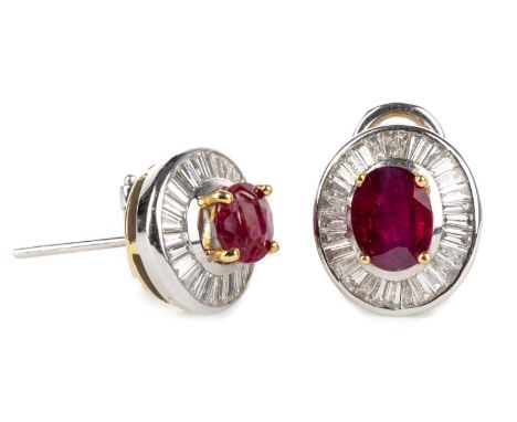 PAIR OF RUBY AND DIAMOND EARRINGS, set with oval rubies within a halo of baguette cut diamonds, marked 18KQty: 10g14.3x12.7mm