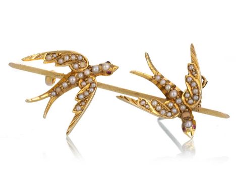 SEED PEARL SWALLOW BROOCH, each bird set with ruby eyes, indistinctly markedQty: 6.4gLoss of multiple pearls to the birds.
