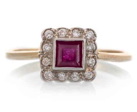 RUBY AND DIAMOND RING, set with a central ruby within a halo of diamonds, unmarked, tests as nine carat gold