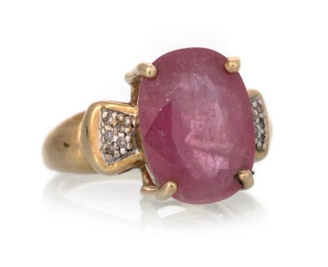RUBY AND DIAMOND RING, the oval ruby flanked by small diamonds to the shoulders, in nine carat gold, size P 1/2Qty: 6.4g