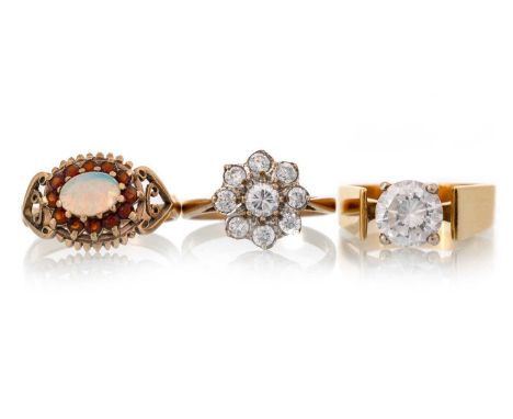 THREE GEM SET DRESS RINGS, comprising a cubic zirconia solitaire ring marked 18K, along with a similar cluster ring, marked 9