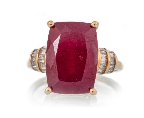 RUBY AND DIAMOND RING, set with an elongated cushion cut ruby on diamond shoulders, in nine carat gold, size O 1/2