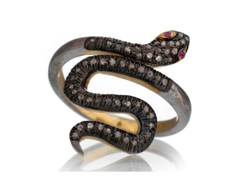 DIAMOND SERPENT RING, with ruby eyes and diamond set body, silver gilt, size Q 1/2Tarnished, slightly bashed. Diamonds of poo