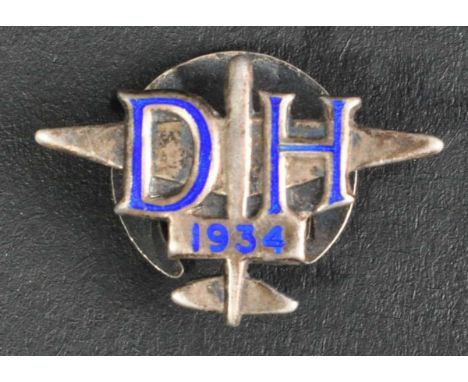 A scarce original pre-WWII Second World War period De Havilland Aircraft Company silver and enamel employee's badge. Blue ena