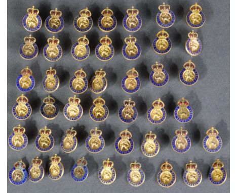 A large collection of original post- WWII Second World War Civil Defence Corps member badges. Gold plated, with blue enamel g