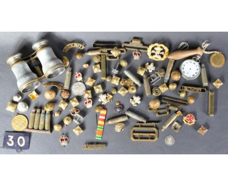 A collection of assorted WWI First and WWII Second World War (and other period) related military items, comprising various un
