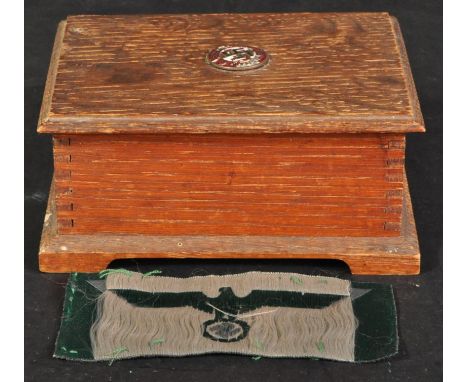 WWII Second World War - an original Third Reich Nazi German cloth uniform patch of an imperial eagle with swastika. In green.