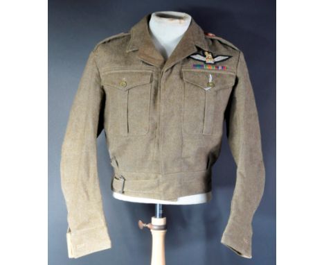 An original WWII Second World War 1940 dated War Department stamped British Army Battledress blouse uniform tunic, with insig