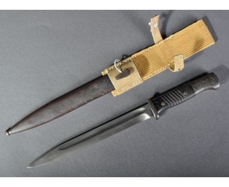 A WWII Second World War German Third Reich Army rifle bayonet. Maker's marks to ricasso for Coppel G. mb. H. Chequered wooden