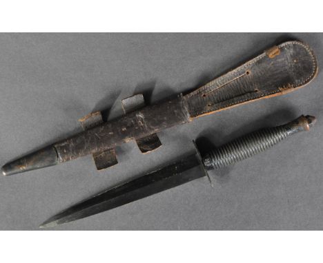 A WWII Second World War Fairbairn Sykes pattern Commando fighting combat dagger. Typical form, with ribbed handle and double 