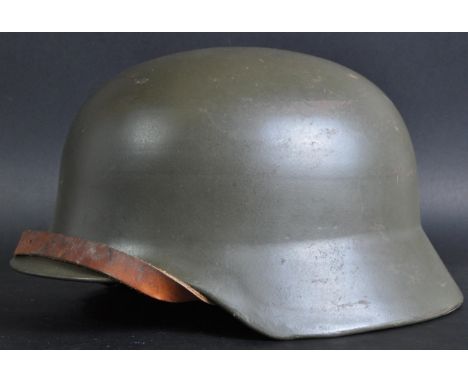 A scarce original post-WWII Second World War c1950s / 60s West German Bundeswehr stahlhelm steel helmet. Based on the WW2 Thi