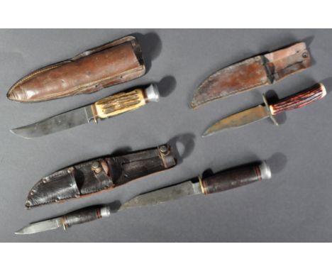A collection of x3 WWII Second World War period combat / fighting knives / daggers. Includes a double set, with miniature dag